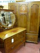 A CIRCA 1900 INLAID MAHOGANY TWO PIECE BEDROOM SUITE of triple door wardrobe and shield shaped