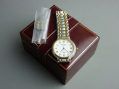 A CASED GENT'S OR LADY'S ROTARY QUARTZ CALENDAR WRISTWATCH