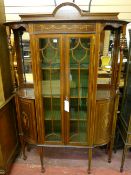 A GOOD CIRCA 1900 INLAID DISPLAY CABINET with shaped railback and top over a decorative central