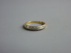 AN EIGHTEEN CARAT GOLD HALF HOOP ETERNITY RING, 3.8 grms, size 'N'