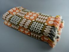 AN EXCELLENT TRADITIONAL WELSH WOOLLEN BLANKET having reverse patterns of orange, cream and