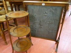 AN ARTS & CRAFTS STYLE PEWTER FIRESCREEN and a mahogany three tier cakestand, the pewter screen