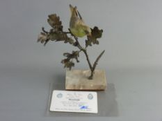 AN ALBANY FINE CHINA GREENFINCH, bronze and porcelain study, on a rectangular marble base, limited