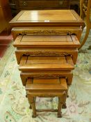 A QUARTETTO OF CONTEMPORARY CHINESE HARDWOOD SIDE TABLES with carved frieze decoration and turned
