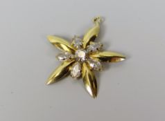 A DIAMOND STAR SHAPED PENDANT in believed 18ct yellow gold (unmarked), 1.6gms