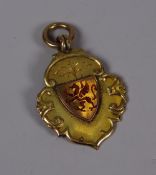 A 9CT GOLD RUGBY UNION PENDANT for the Mallett Cup, 1937 and having an enamel Welsh dragon crest