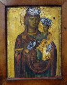 AN EIGHTEENTH / NINETEENTH CENTURY RELIGIOUS ICON of painted and silver mounted wooden form, framed,