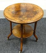 AN EDWARDIAN WALNUT MARQUETRY TOP TABLE of circular form with lower platform & on ceramic castors,