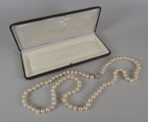 SINGLE-STRAND PEARL NECKLACE having 18ct white gold diamond set globular clasp
