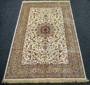 IVORY GROUND KASHMIR CARPET with traditional Shabaz medallion design, 193 x 296cms