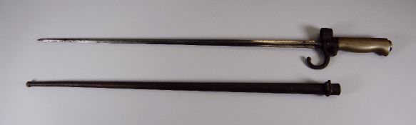 A LONG WW1 PERIOD CRUCIFORM BAYONET with scabbard and brass handle and marked with a letter 'B' in