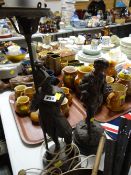 Continental spelter figure of a schoolboy together with a Spanish soldier in the form of a table