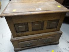 A nineteenth century oak coffer bach with two base drawers (distressed for restoration)