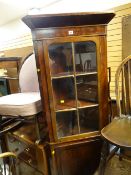 A standing mahogany corner cupboard / cabinet