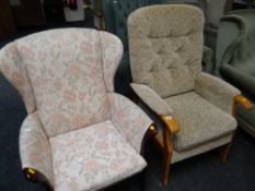 A modern upholstered cushioned high back armchair together with another similar