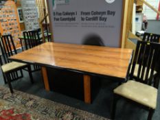 An Art Deco-style wood effect & ebony bordered dining table together with four matching high back b