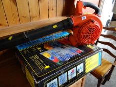 A petrol driven leaf blower & boxed storage unit