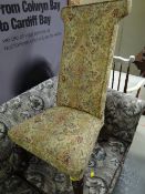 A floral upholstered prie dieu chair