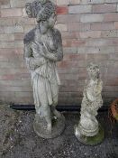 Two composite garden statues, Pandora & another (outside)
