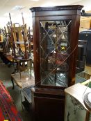 A standing corner cabinet plus sundry small furniture