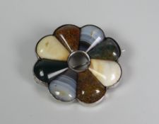 A SILVER & AGATE BROOCH in circular fanned form with hollow circular centre, 4.75cms diam (BBC
