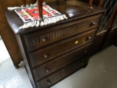A Priory linen-fold or similar four-drawer chest