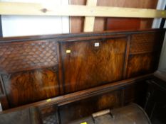 A pair of flame mahogany & carved bed ends