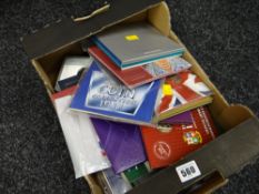 A collection of Royal Mint coin collecting sets including the millennium coin, diamond wedding