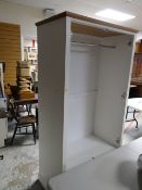 A modern white wood two-drawer wardrobe with lower drawer together with two similar chests of