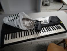 A Yamaha Portatone electric keyboard E/T