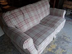 A tartan upholstered sofa bed