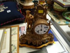 A reproduction gilt French-style mantel clock