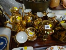 A tray of various continental lustre ware, coffeeware together with a Wade lustre jug