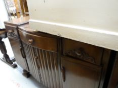 A vintage carved convex sideboard