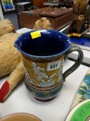 A rare Doulton Lambeth 1883 single-handled jug decorated in relief with rugby playing figures with