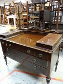 A mahogany dressing table with a bank of five drawers