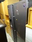 A good Samsung American-style fridge freezer with ice machine dispenser E/T