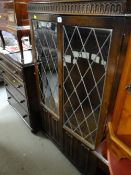 A Priory or similar linen fold two-door bookcase
