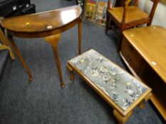 A reproduction mahogany demi-lune hall table together with a cushion topped long footstool