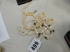 Three pearl necklaces