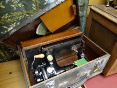 A vintage Singer sewing machine in a case