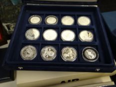 Three part-Mint silver coin collections, the official coins of Australia, silver fifty dollar coin