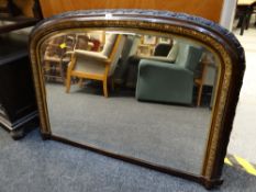 A good gilt & ebonized carved overmantel mirror