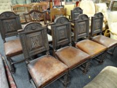 A set of six antique arch topped high backed dining chairs with back panels believed to be carved