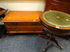 A reproduction drum-top side table with green leather tool top together with a reproduction yew TV /