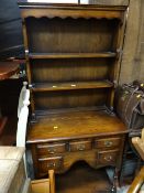 A compact reproduction kitchen dresser