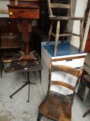 An antique adjustable reading table & two wooden chairs