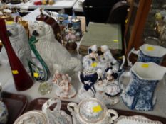 Two Staffordshire dogs, continental figures, coloured glass etc