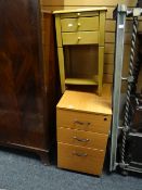 Modern three-drawer wood effect filing cabinet together with a small lightwood two-drawer bedside
