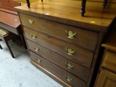 An antique mahogany chest of four long drawers